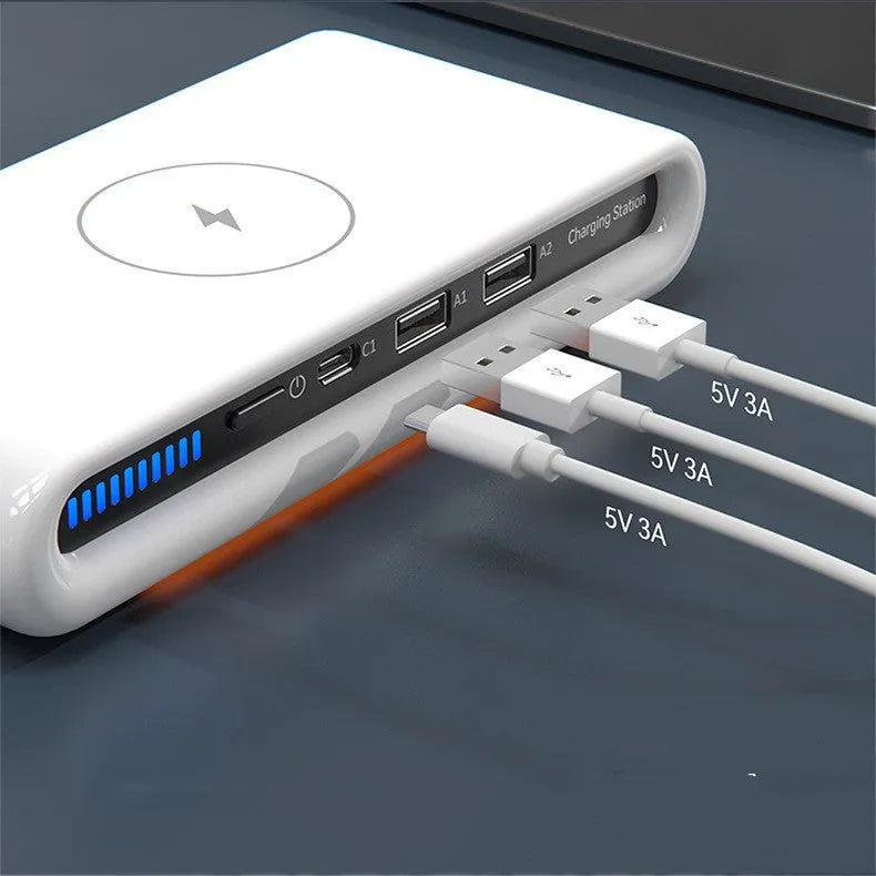 White desktop wireless charging pad with multicolour LED atmosphere lighting and a coiled Type-C cable.