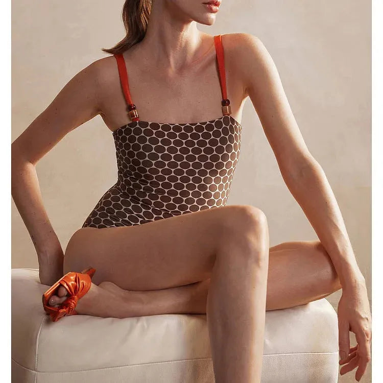 Women's printed dots pattern one-piece swimsuit with matching wrap skirt, shown in multiple colours.