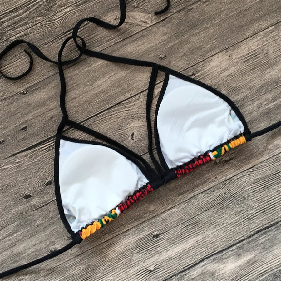 Women's split bikini swimsuit with digital printing, showing high-waist briefs and backless top design for swimming
