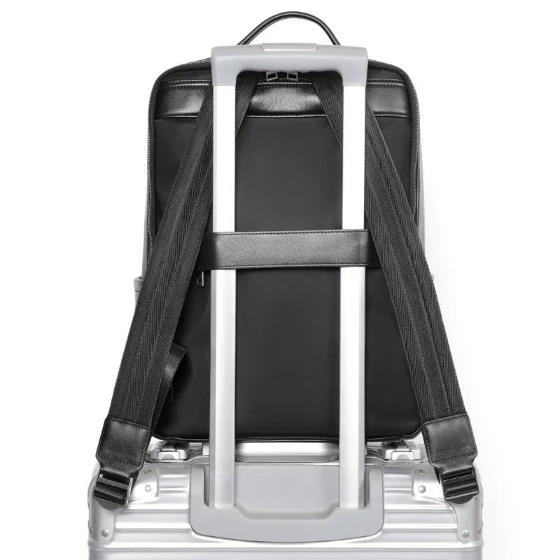 Men's black genuine leather large capacity computer backpack with woven details.
