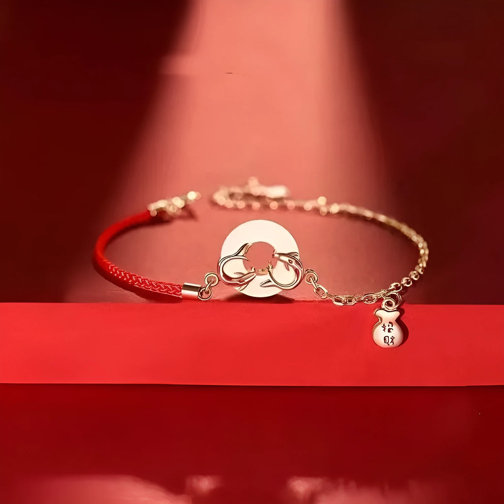 Women's red rope festive koi bracelet with peace buckle fastening and fishtail detailing