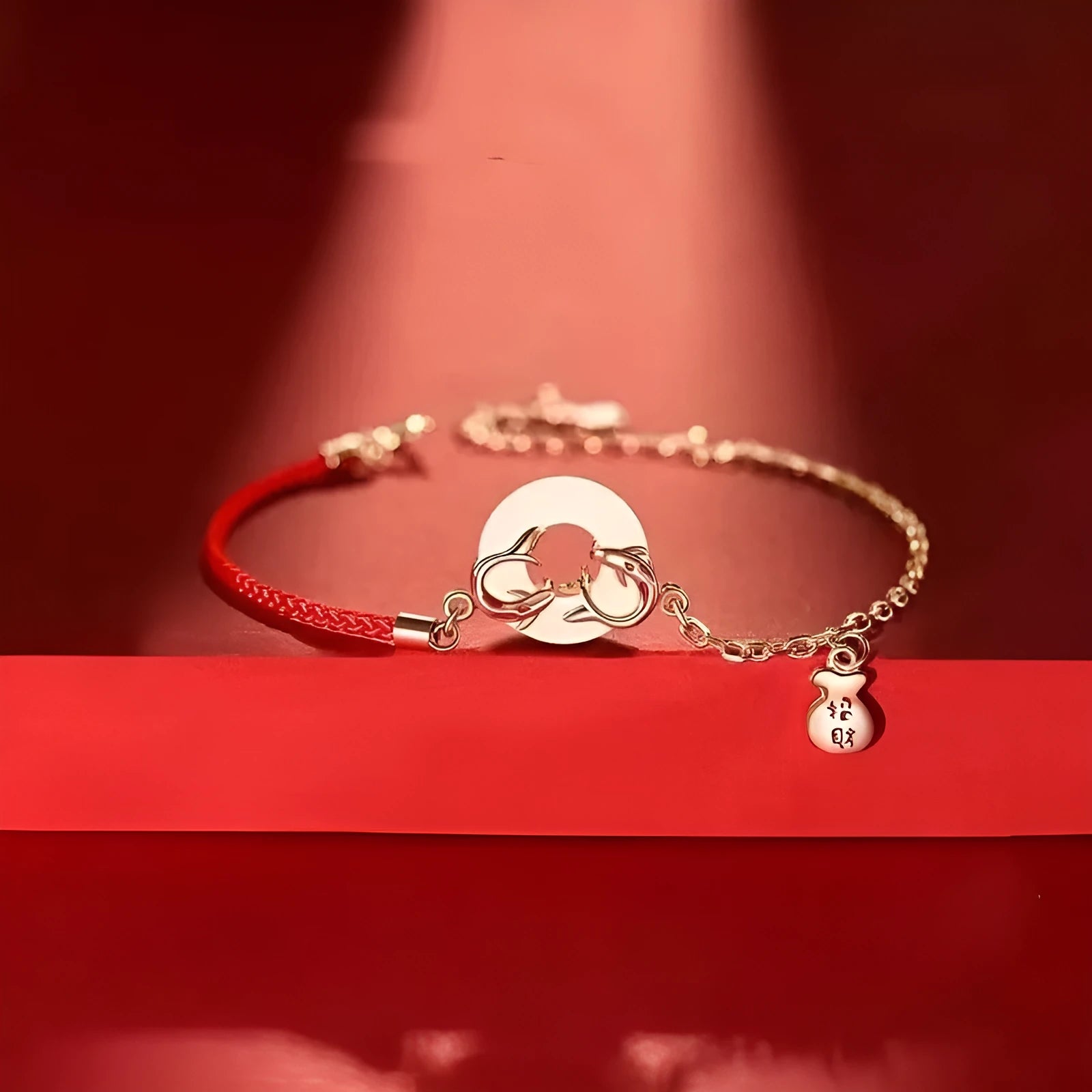 Women's red rope festive koi bracelet with peace buckle fastening and fishtail detailing