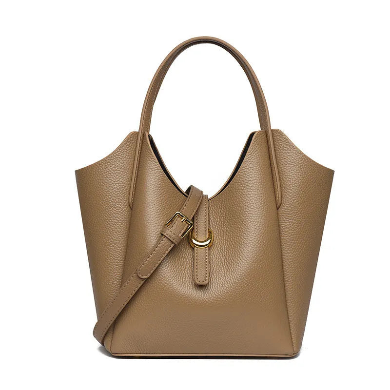 Genuine leather women's retro bucket handbag in beige with sewn detailing and an outer pocket.