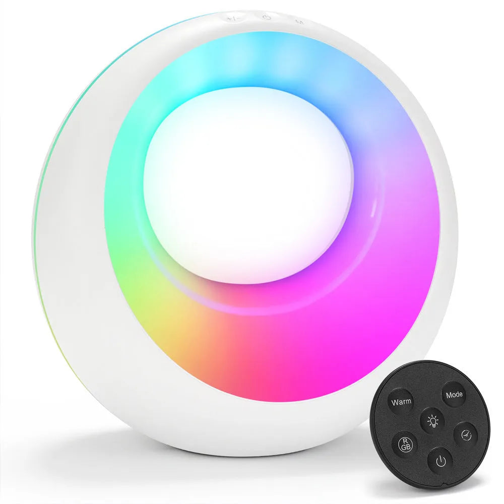 Small RGB colour changing night lamp with remote control on wooden desk