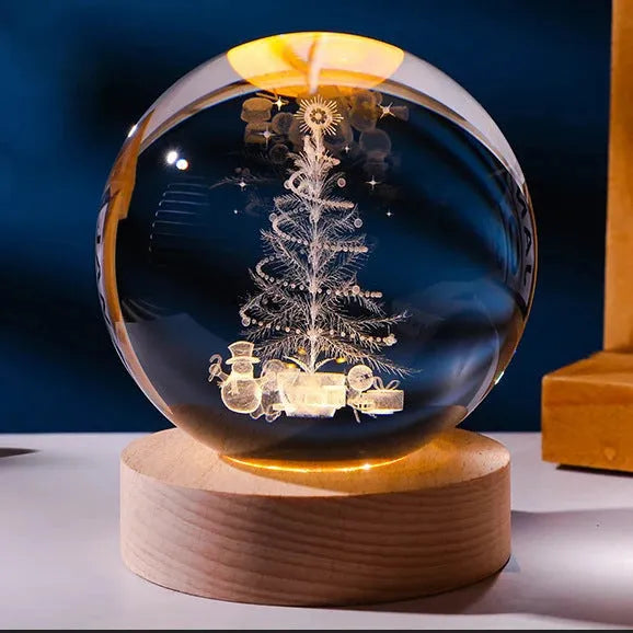 3D crystal ball night light projecting starry sky and planets from its 6cm sphere on a solid wood base.