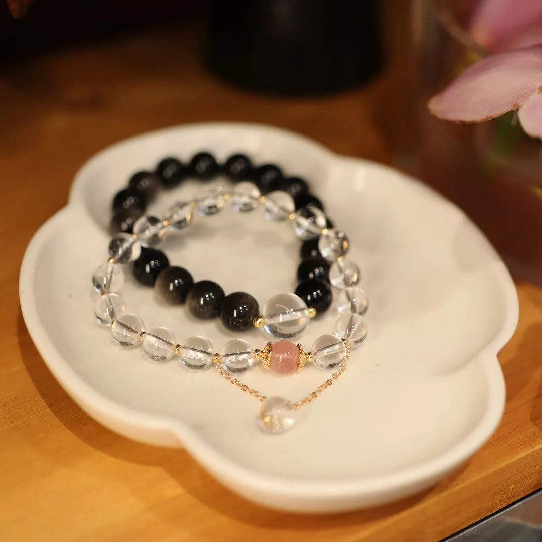 White crystal geometric bracelet with cat eye obsidian stones and Chinese auspicious patterns