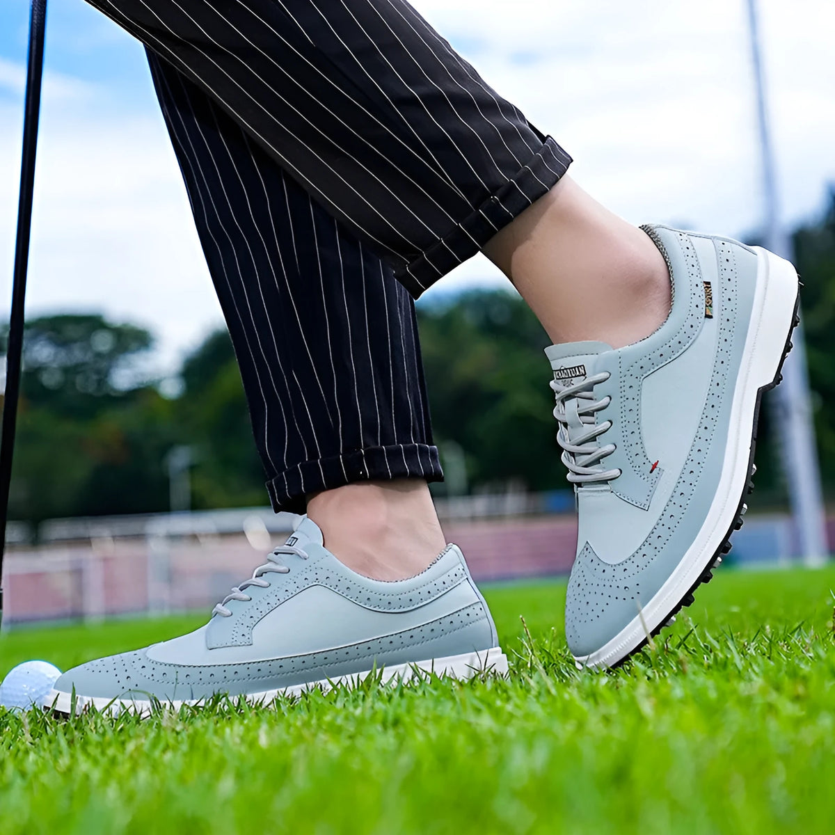 Men's genuine leather golf shoes with non-slip rubber outsole in Lake Blue and White colour options.