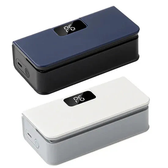 Small white portable heat sealing machine for plastic food bags on a kitchen counter.
