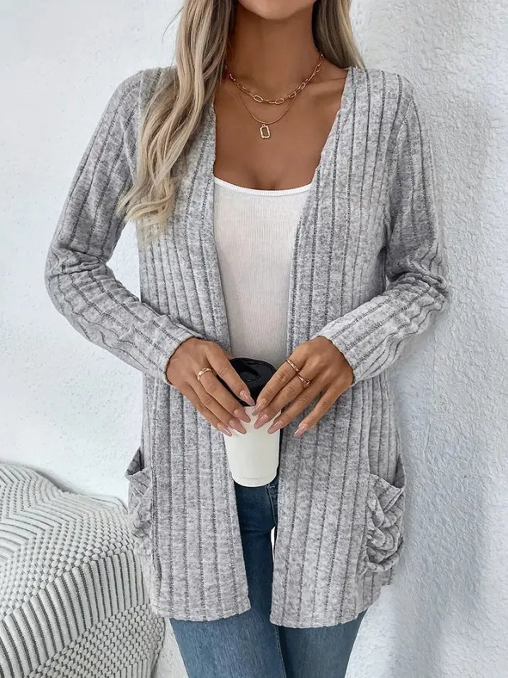 Solid colour long sleeve cardigan knitwear with two pockets, shown in granny grey.
