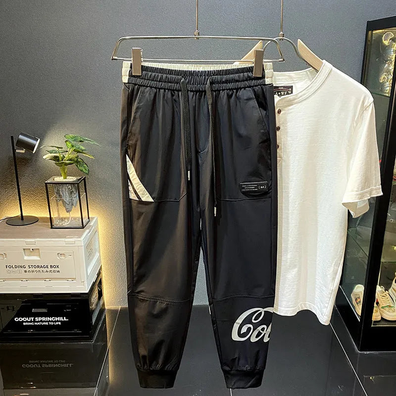 Black men's casual cropped trousers with elasticated ankle bands made from ultra-thin ice silk cotton.