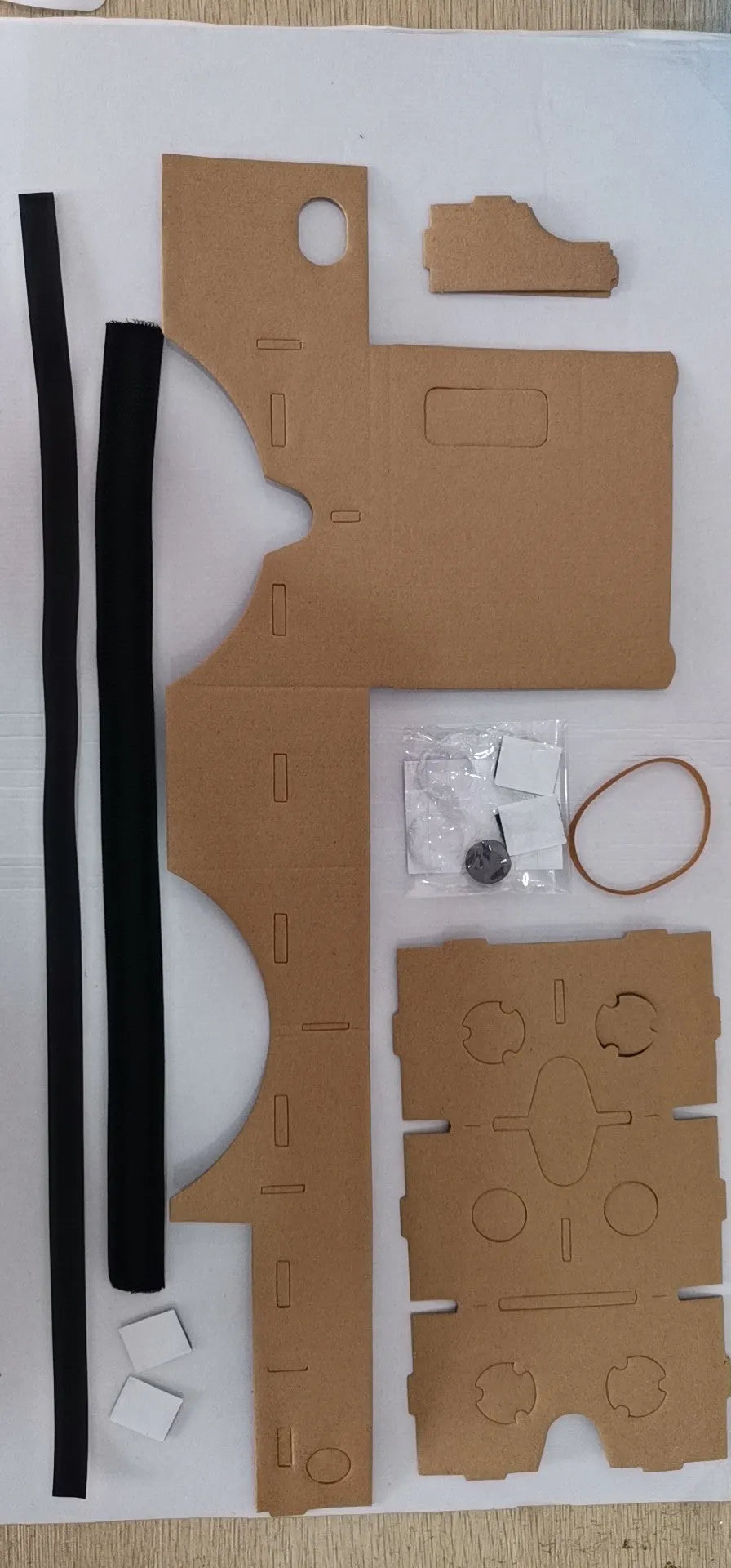VR Cardboard Glasses showing cardboard frame with 3D lenses, adjustable rubber band, and velcro strap for smartphone virtual reality