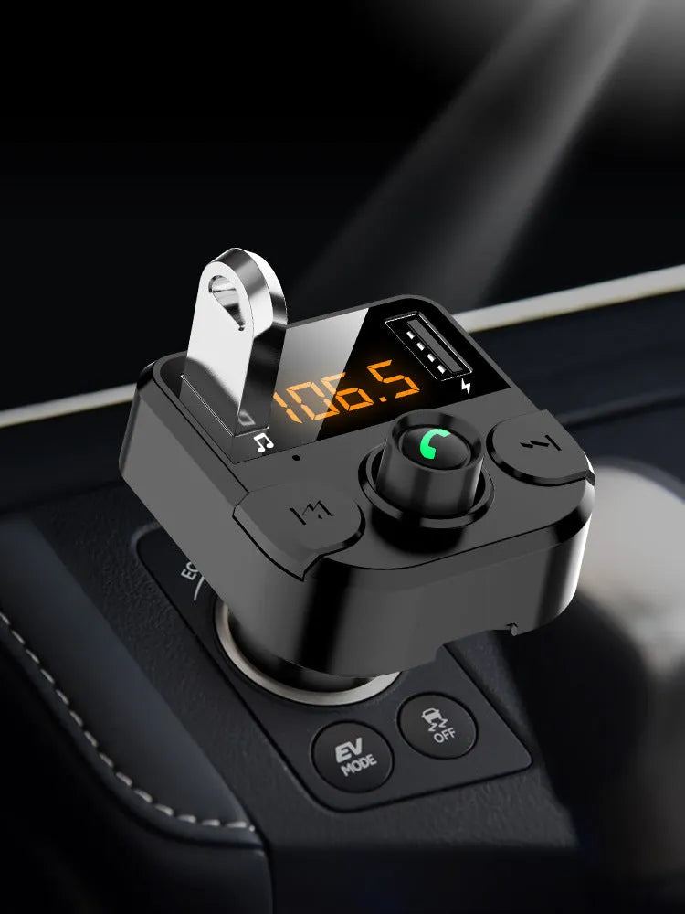 Black BT36B Bluetooth car MP3 player with FM transmitter and 1.1-inch display, connected to a car cigarette lighter.