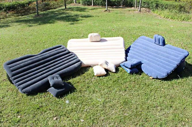 Black wave colour inflatable car bed with two pillows on a car seat