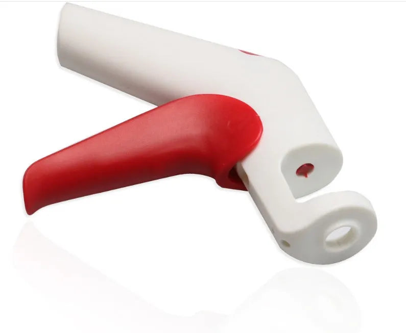 Stainless steel cherry kernel remover with 2.5cm plunger and 15cm handle on kitchen surface