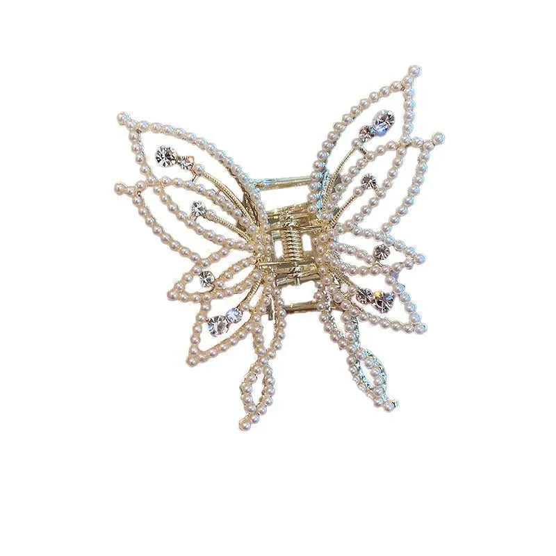 Butterfly hair barrette measuring 6.7cm x 6.2cm with electroplated alloy construction