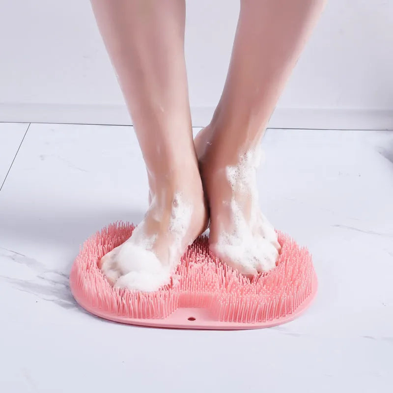 Orange massage bath brush with suction cups and silicone bristles on a 23x30cm TPR mat
