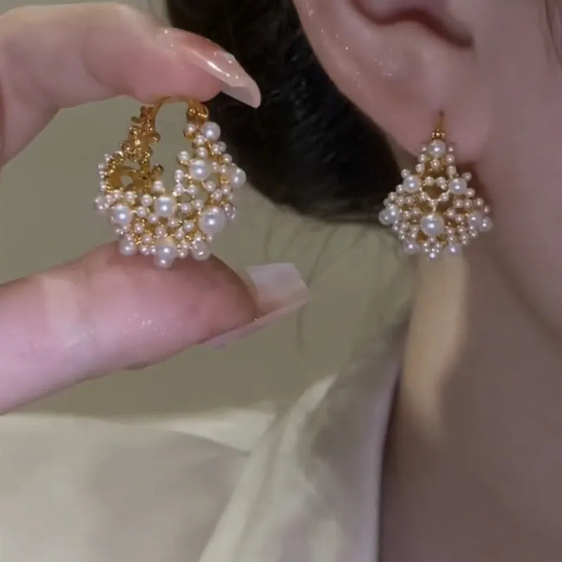 Women's copper flower basket earrings with small rice-shaped beads in gold finish, approximately 3-4 cm diameter