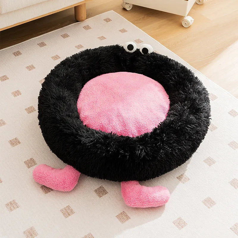 Blue plush kennel-style dog bed with raised sides, shown on a wooden floor.