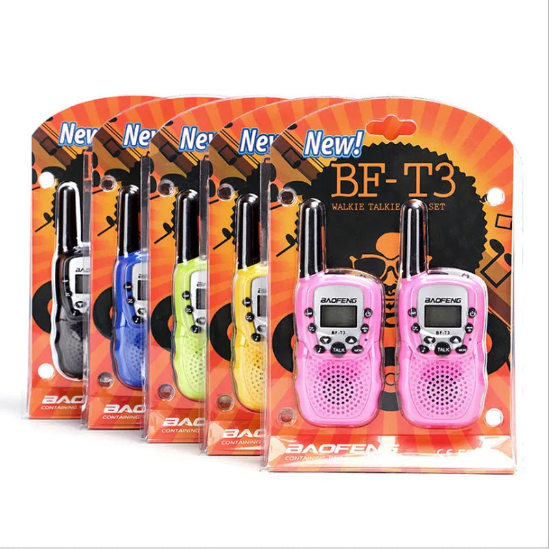 Child walkie talkie in multiple colours with extended antenna, showing push-to-talk button and channel selector
