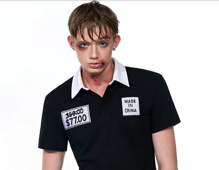 Black slim fit men's polo shirt with short sleeves and embroidery hat design detail