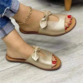 Ladies sandals with fish mouth design, bow detailing, and rubber sole in black, pink, or gold colours