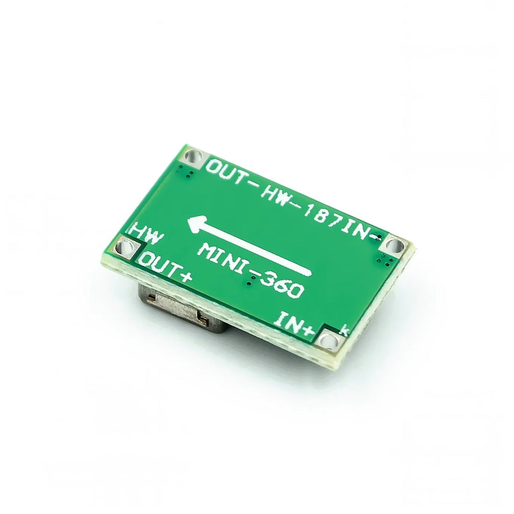 Mini 360 green DC-DC buck converter step down power module on a white background