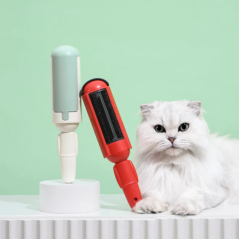 White green coloured pet hair remover roller with a non-slip handle on a fabric sofa.
