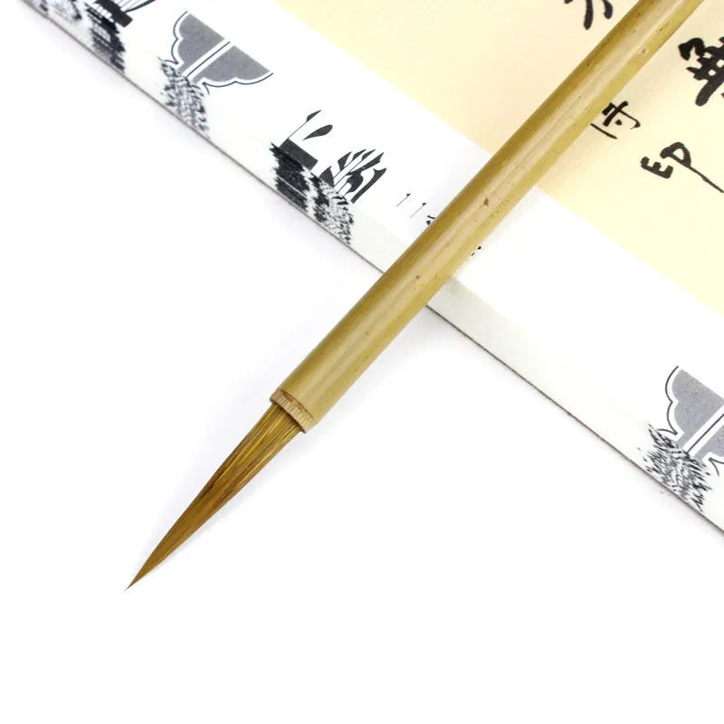 Langhao traditional Chinese calligraphy brush with wolf hair nib, shown beside ink and paper.