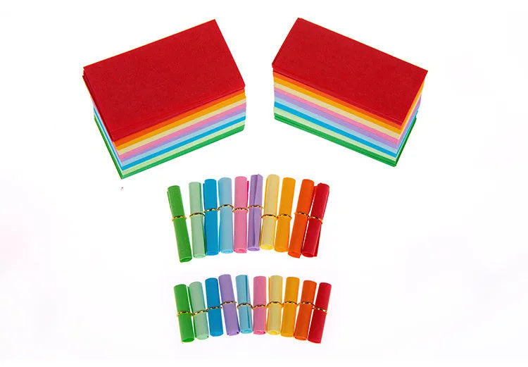 Assorted colourful mini paper scrolls with eyelets for drift bottle messages in sizes 3x7cm, 4x7cm, 7x7cm, and 5x5cm.