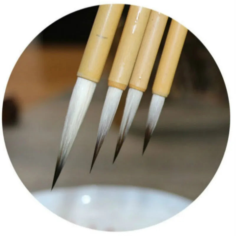 Set of four gold body writing brushes with wolf hair bristles in pine branch colour