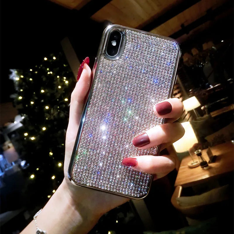 Silver silicone full diamond phone case for iPhone on a table