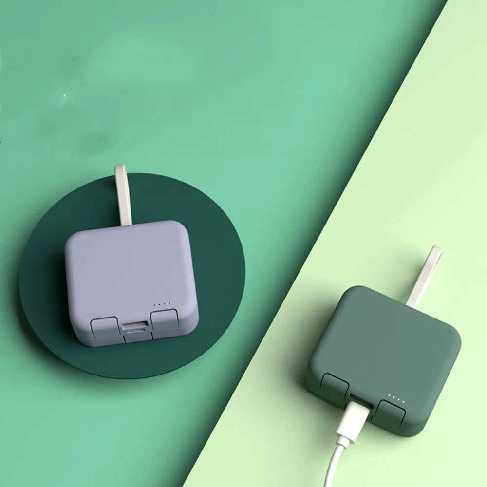 Handbag back clip power bank in four colours showing clip mechanism and dual charging ports