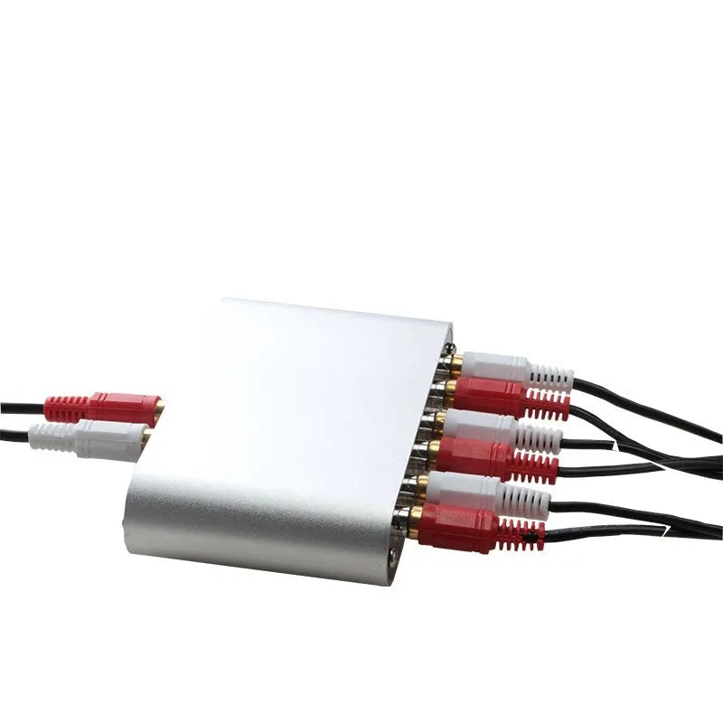 Silver aluminium alloy audio source switcher unit with front-panel switch button and infrared remote control.