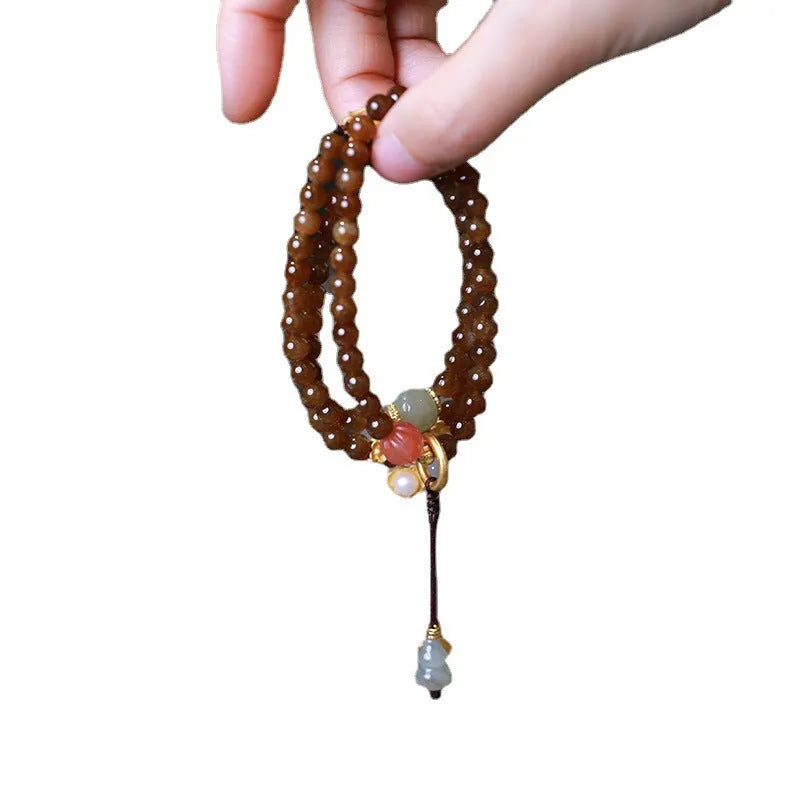 Brown Hetian jade three-ring bracelet with geometric design, butterfly motifs and silver accessories