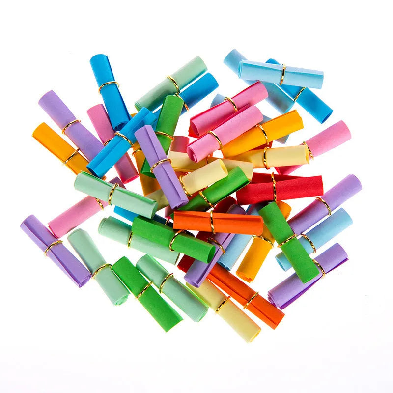 Assorted colourful mini paper scrolls with eyelets for drift bottle messages in sizes 3x7cm, 4x7cm, 7x7cm, and 5x5cm.