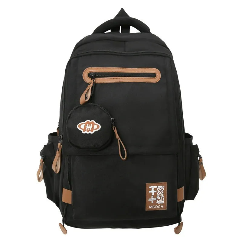 Large nylon school backpack in a solid colour with curved shoulder straps, shown from a side angle.