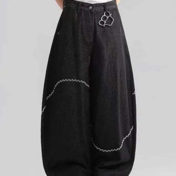 Black straight-leg denim trousers with mid-waist and zip placket on hanger showing micro-elastic polyester fabric