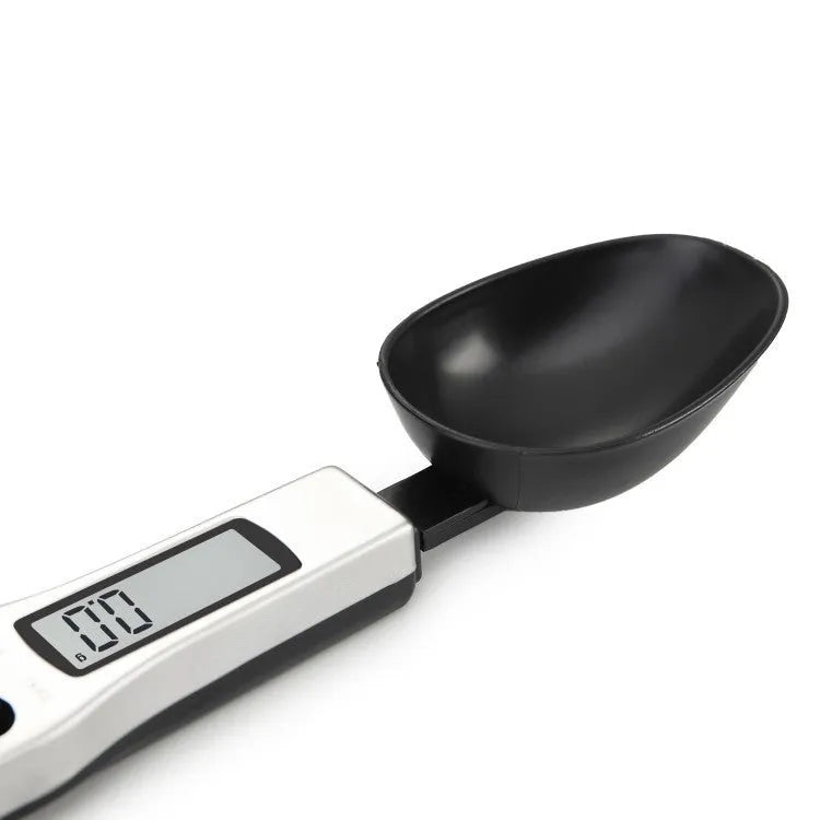 Digital measuring spoon with LCD display showing weight measurement