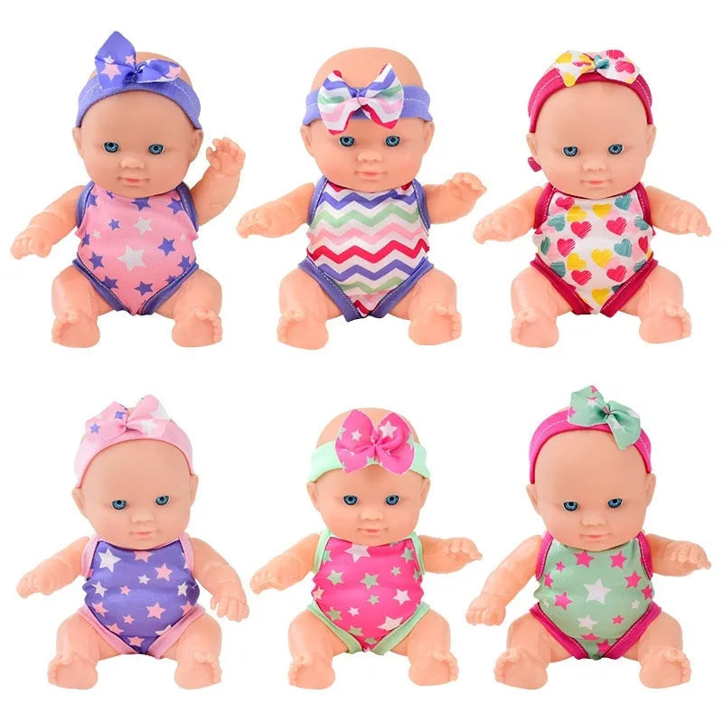 Simulation baby vinyl figurine doll displayed on a surface, showing detailed features.