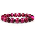 Natural tiger eye crystal bracelet with round beads in dark blue colour, showing tiger eye banding patterns