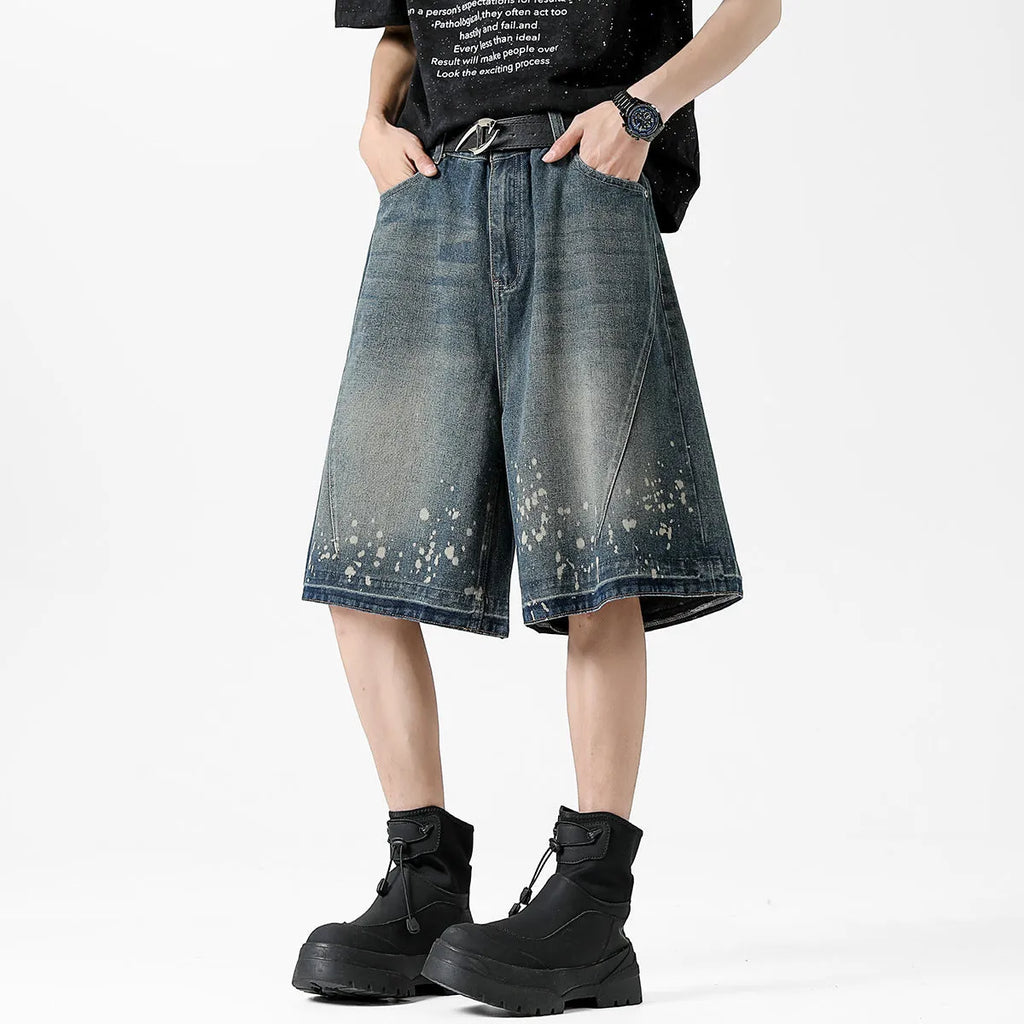Men's retro washed blue denim shorts with five-point ripped splash ink design in straight cut