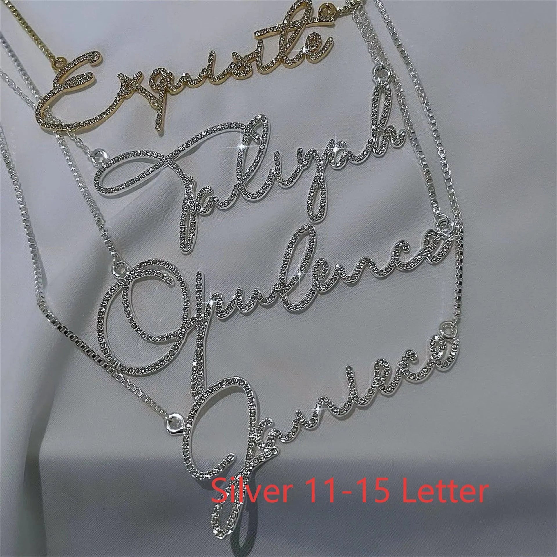 Personalised stainless steel name necklace with diamond-studded letters on a chain, shown in rose gold.