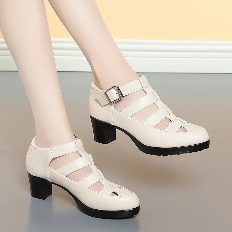 Women's beige closed toe sandals with chunky heel, woven hollowed upper, and ankle strap buckle.