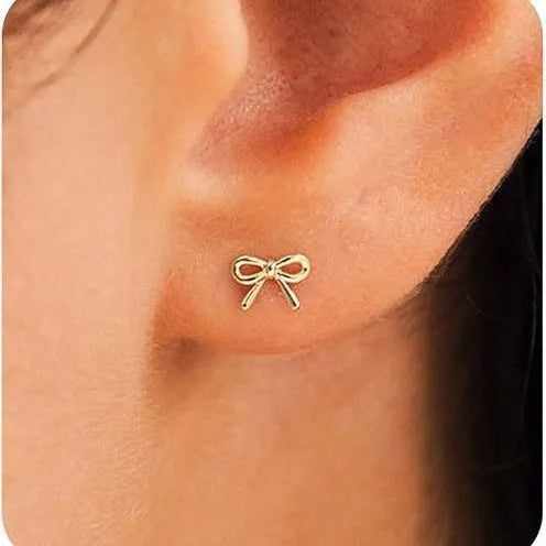 Women's geometric bow and cross stud earrings in gold and silver electroplated finishes
