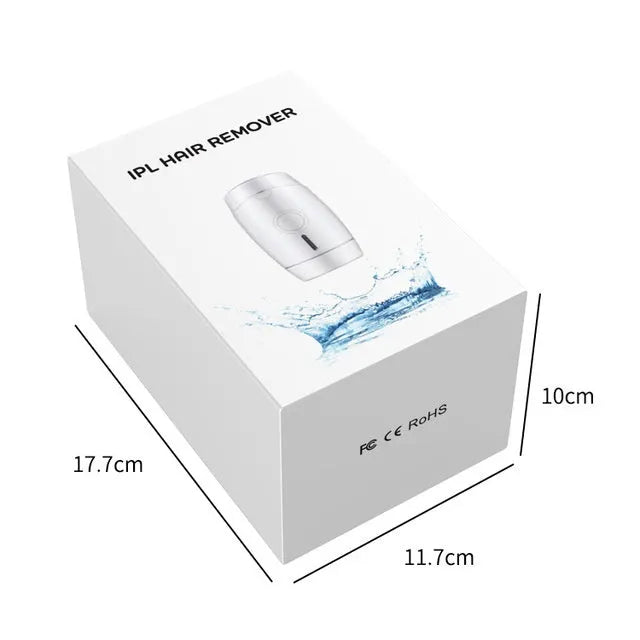 White home IPL laser hair removal device on a table.