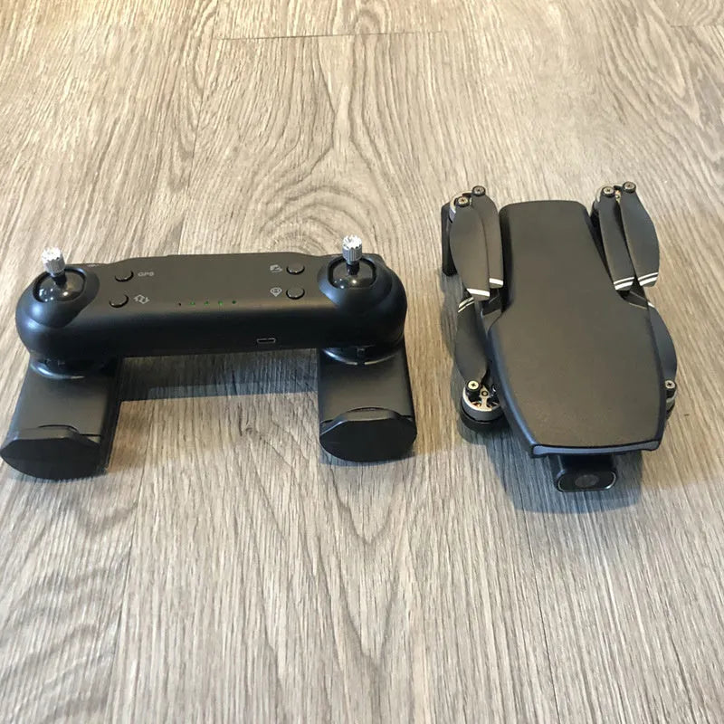 Black folding remote control drone with brushless motor, 4K HD camera, GPS, 4-channel handle remote, and plastic body.