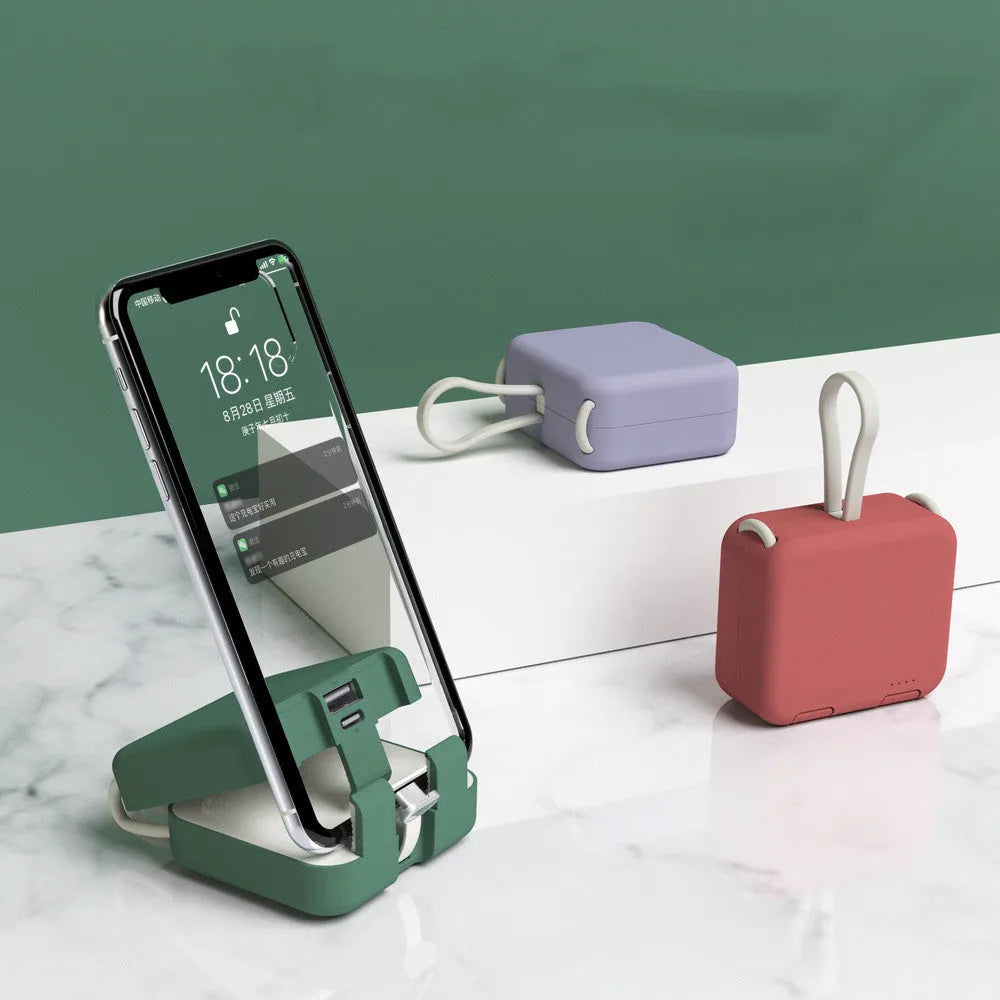 Handbag back clip power bank in four colours showing clip mechanism and dual charging ports