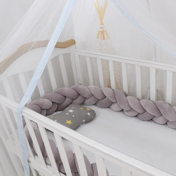 Baby crib bumper with braid knot design in spandex velvet, showing adjustable length protection around crib rails