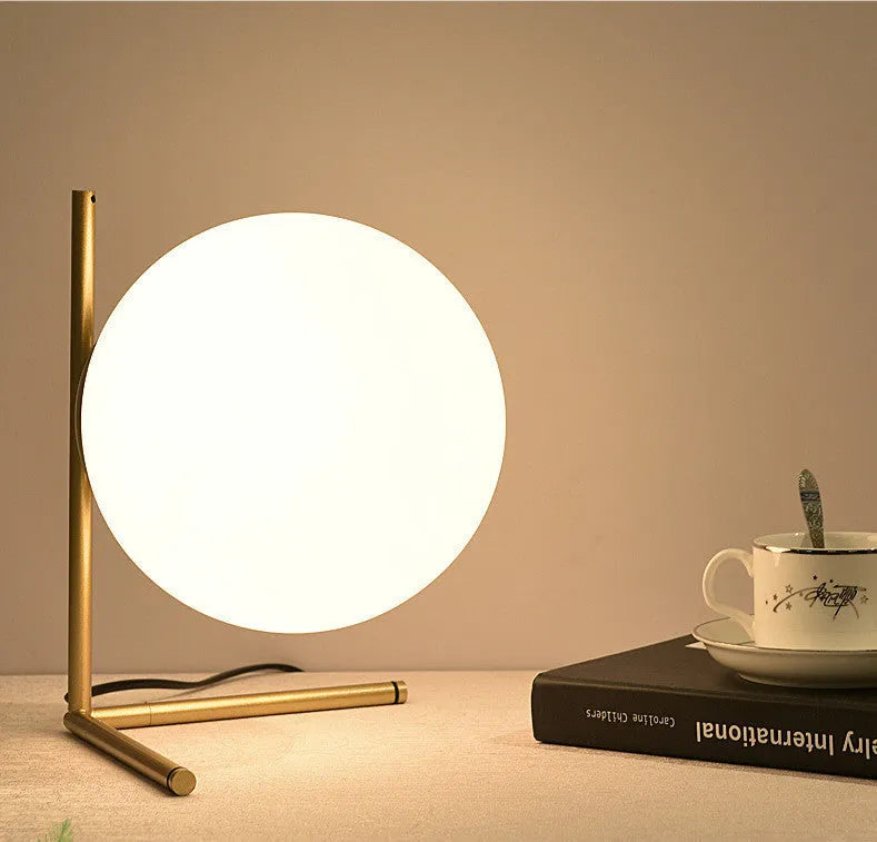 Creative LED table lamp with glass shade in one of three style sizes, showing push button for three-tone light control.