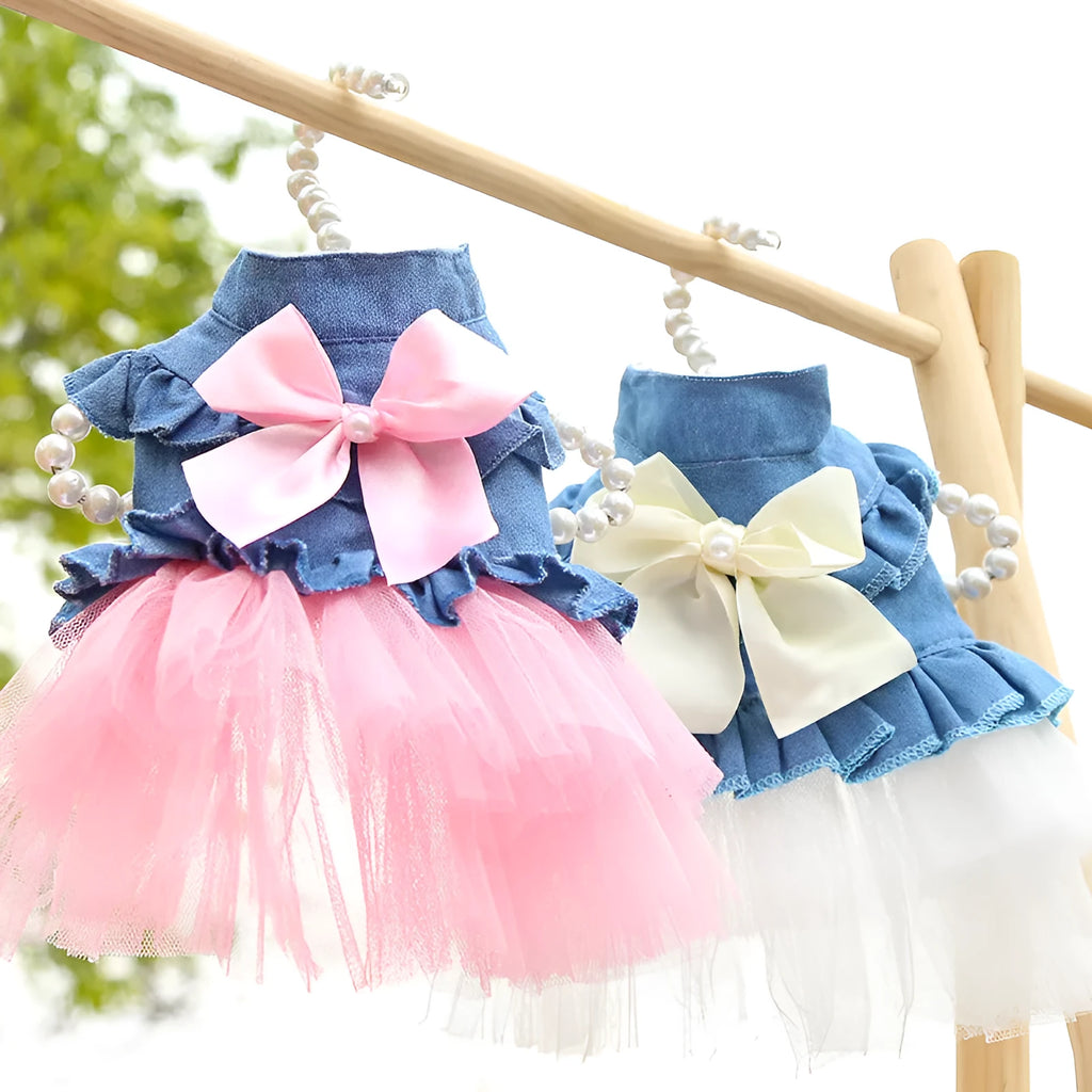 Korean-style denim dog skirt with bow detail in white or pink yarn, shown on a model dog.